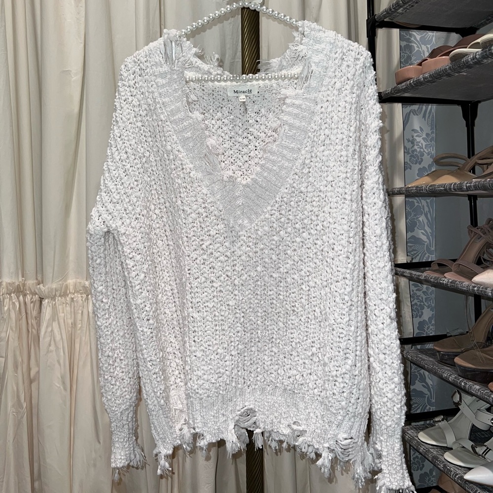 Frayed sweater